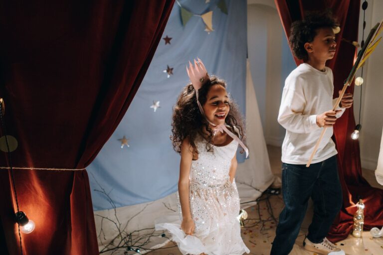 Two children in costumes performing a scene
