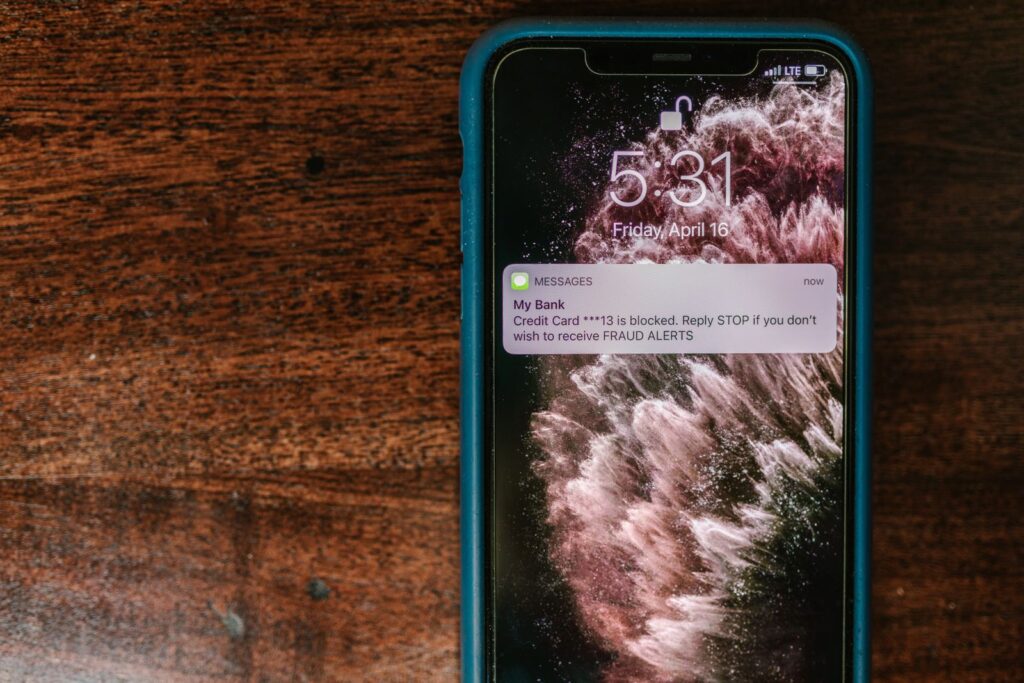 Smartphone displaying a fraud alert message