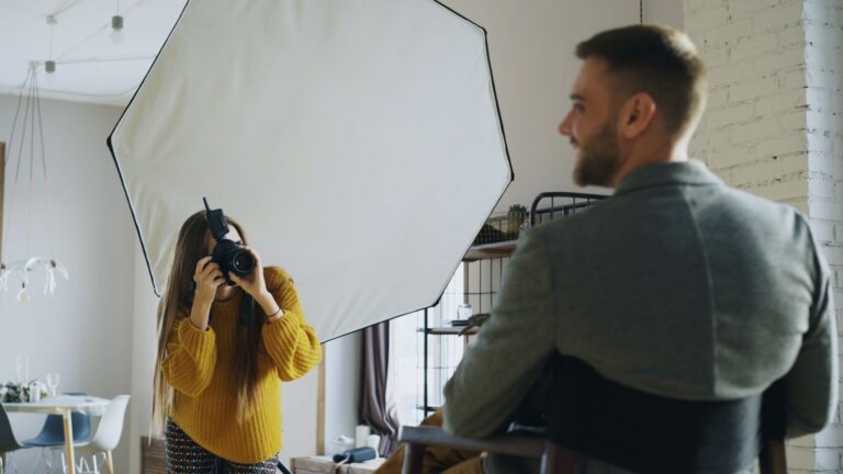 Photographer shooting a portrait with softbox lighting